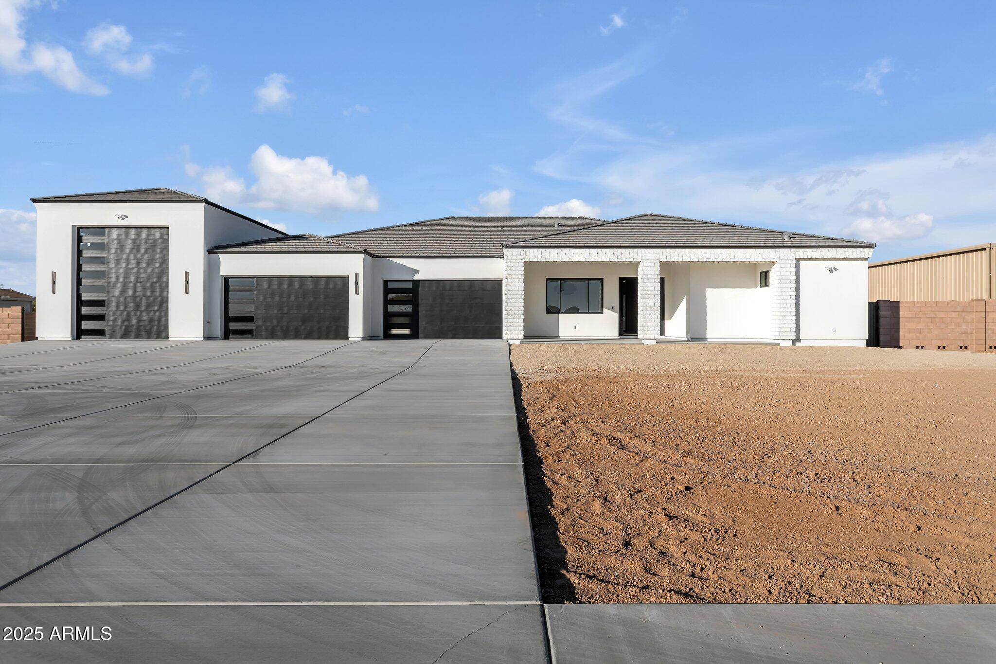 36321 North 16th Street Phoenix, AZ 85086 - Photo 1 of 45 a view of a house with a barbeque and large trees