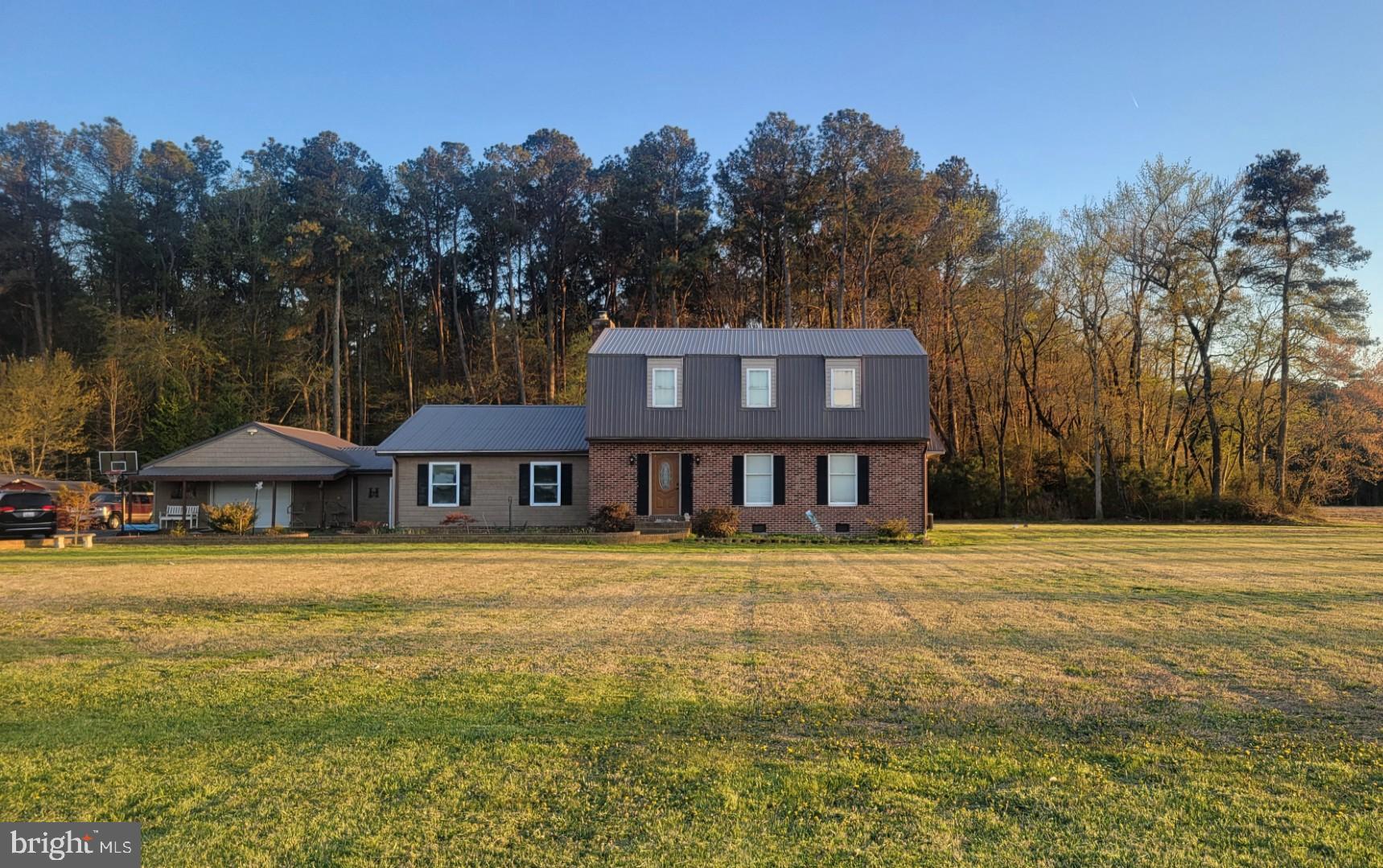 3518 Sheephouse Road Pocomoke City, MD 21851 - Photo 1 of 59 a front view of a house with a garden