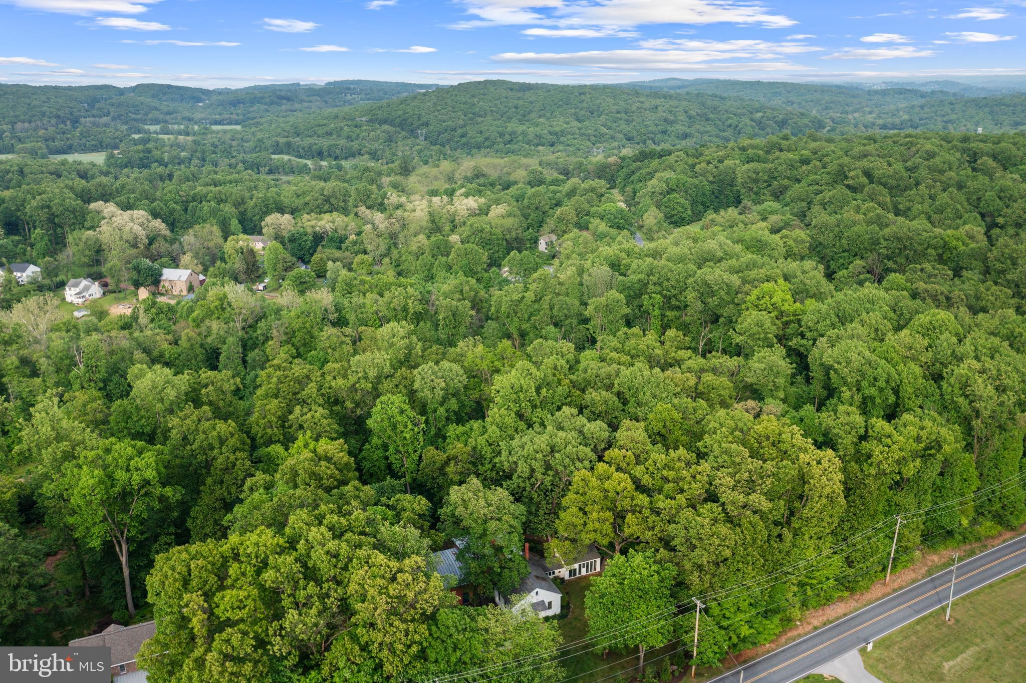 1410 Little Conestoga Road Glenmoore, PA 19343 - Photo 1 of 8 a view of a green field with lots of bushes