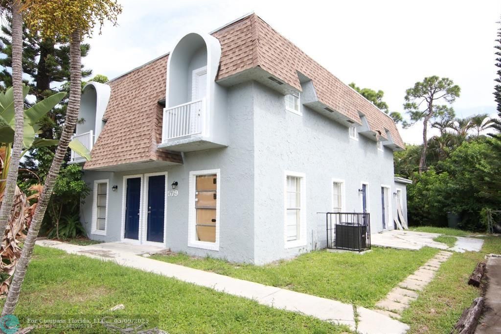 579 Northwest 41st Street Fort Lauderdale, FL 33309 - Photo 1 of 1 a front view of a house with garden