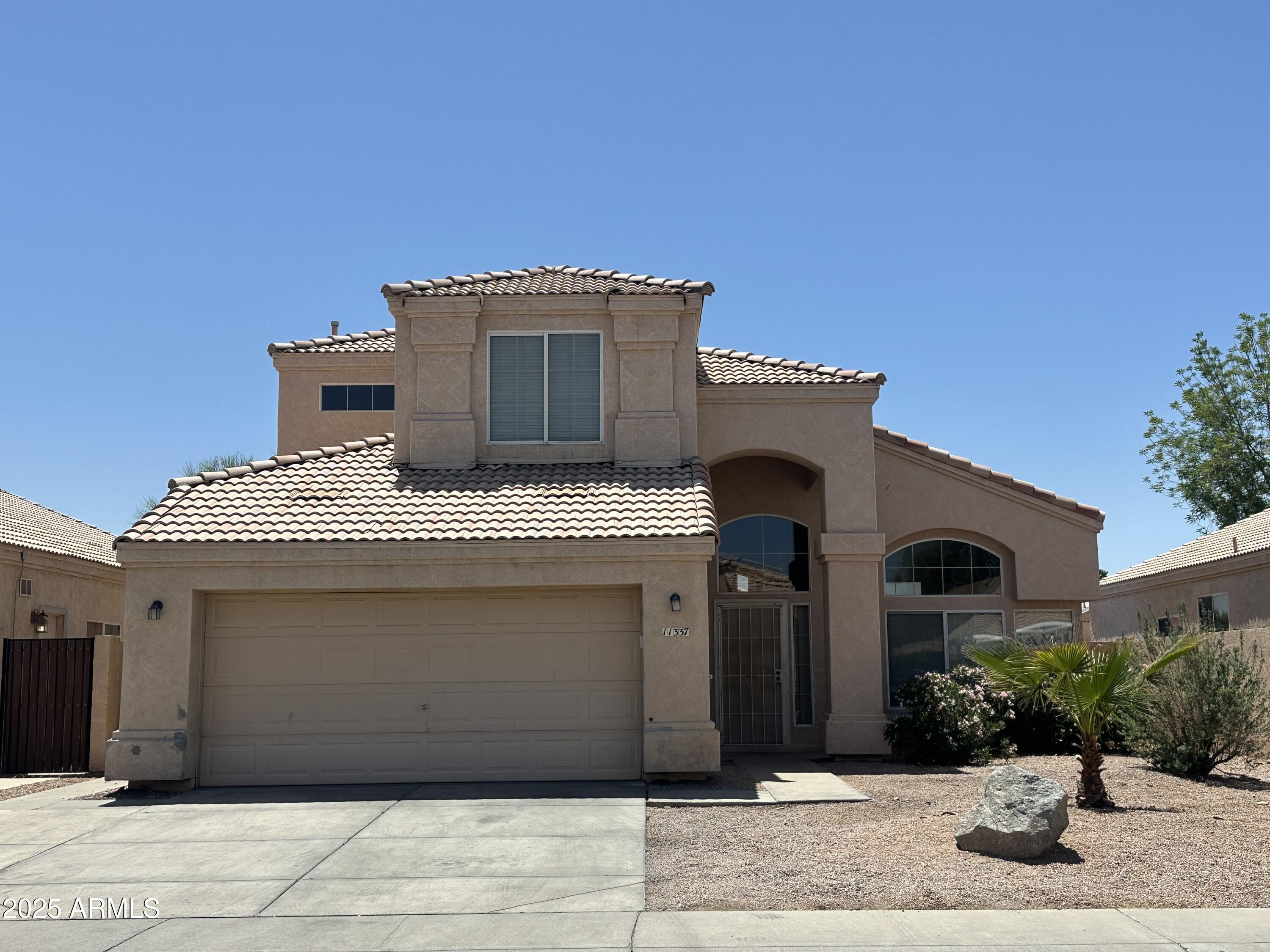 11337 West Dana Lane Avondale, AZ 85392 - Photo 1 of 30 a front view of a house