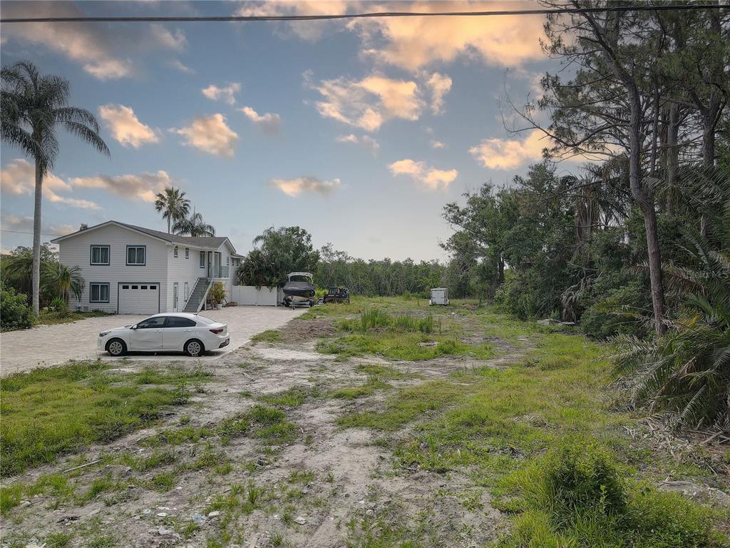 8115 Bay Drive Tampa, FL 33635 - Photo 1 of 20 a big yard with table and chairs
