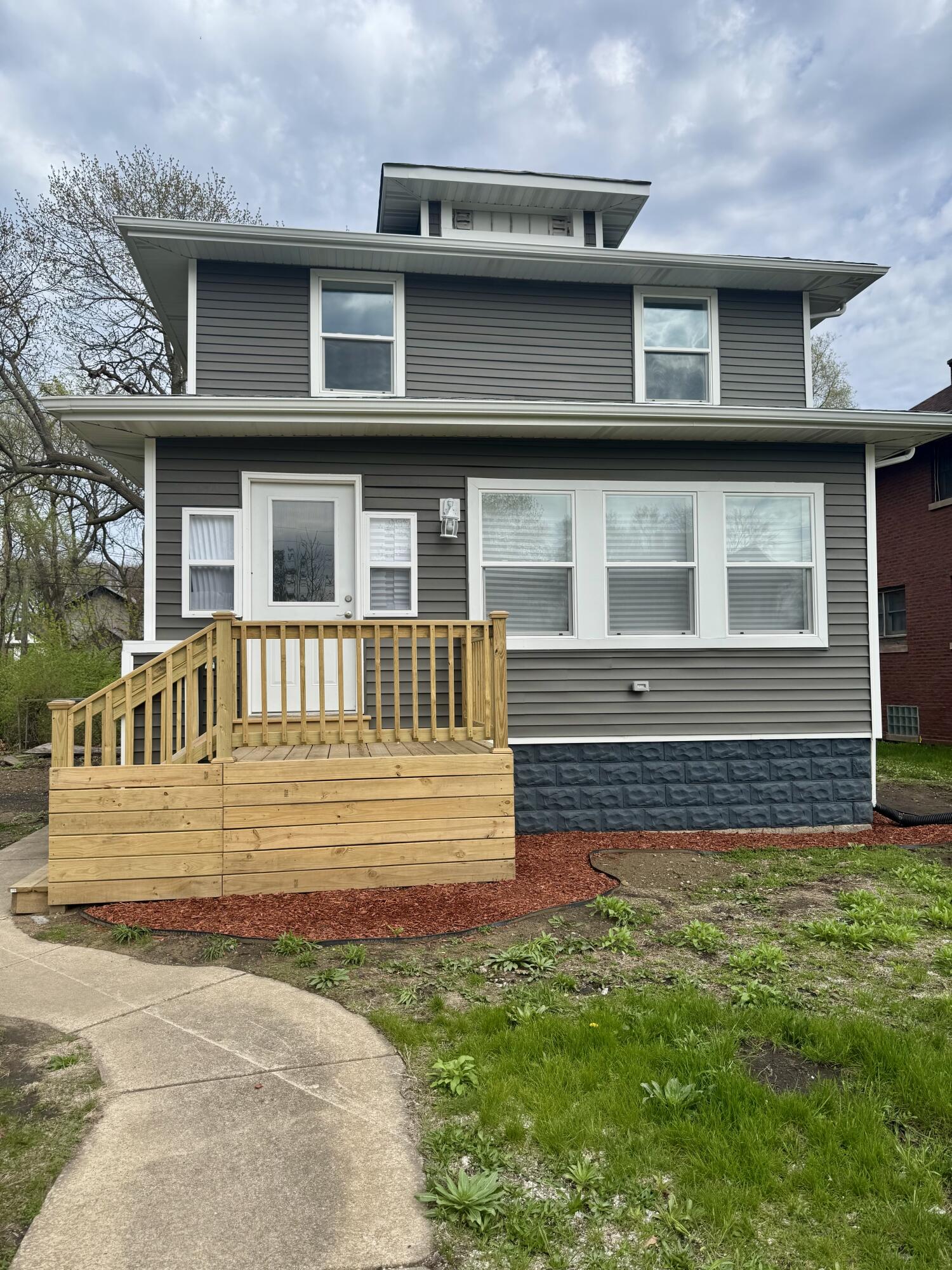 725 Polk Street Gary, IN 46402 - Photo 1 of 26 a front view of a house with a yard