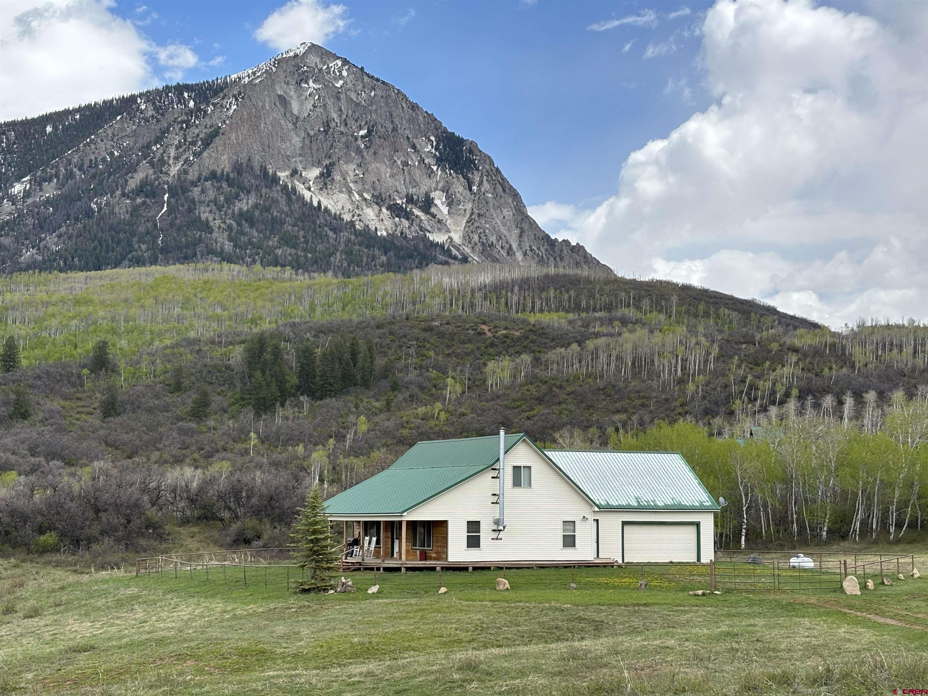 22501 County Road 12 Somerset, CO 81434 - Photo 1 of 24 a front view of a house with garden